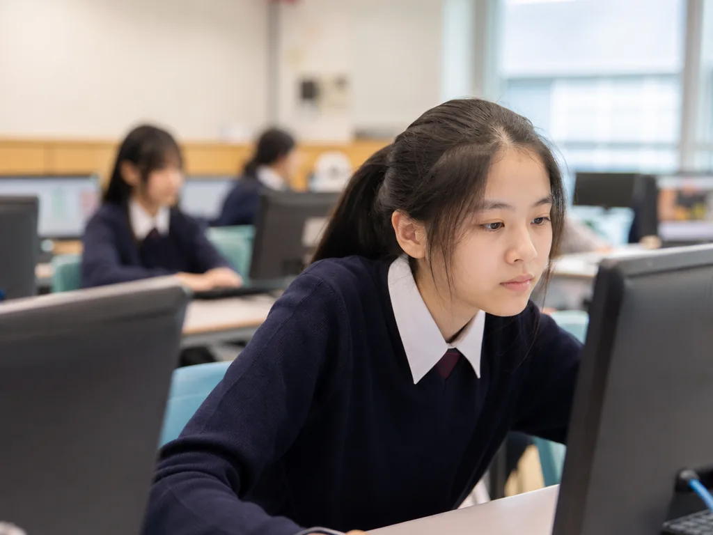 IGCSE ICT (Information and Communication Technology): Complete Guide to Curriculum, Exam Structure & Study Tips 5 IGCSE ICT students working on computers